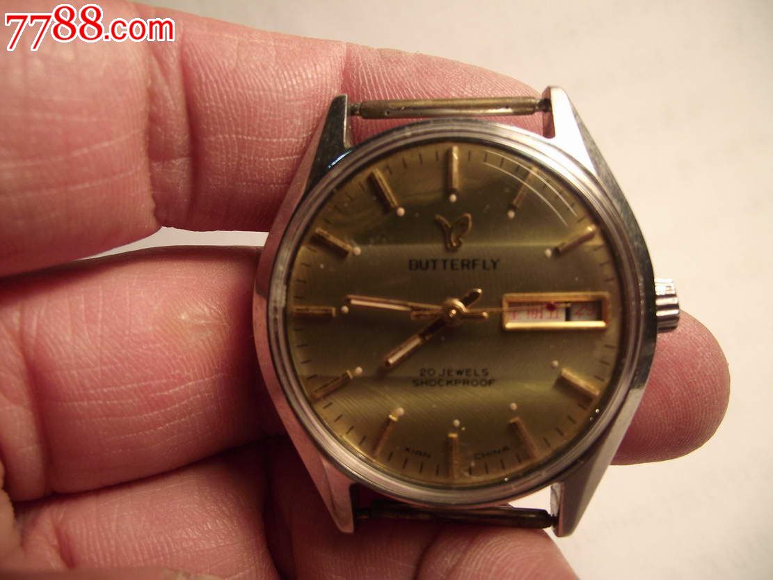 西安蝴蝶手表厂产黄条纹盘双历大蝴蝶表